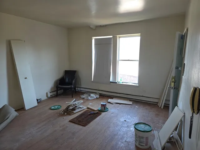 a room with gym equipment and a window