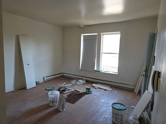 a room with gym equipment and a large window