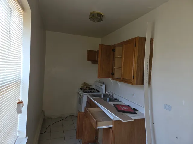 a bathroom with a sink and cabinets