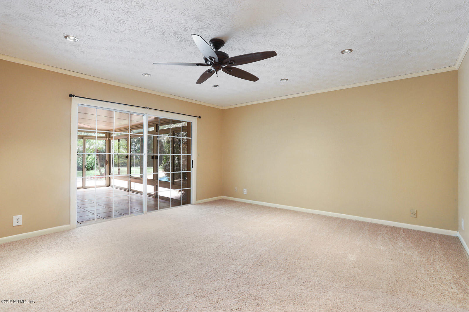 9482 Wexford Road Jacksonville, FL 32257 - Photo 11 of 25 a view of an empty room with a window