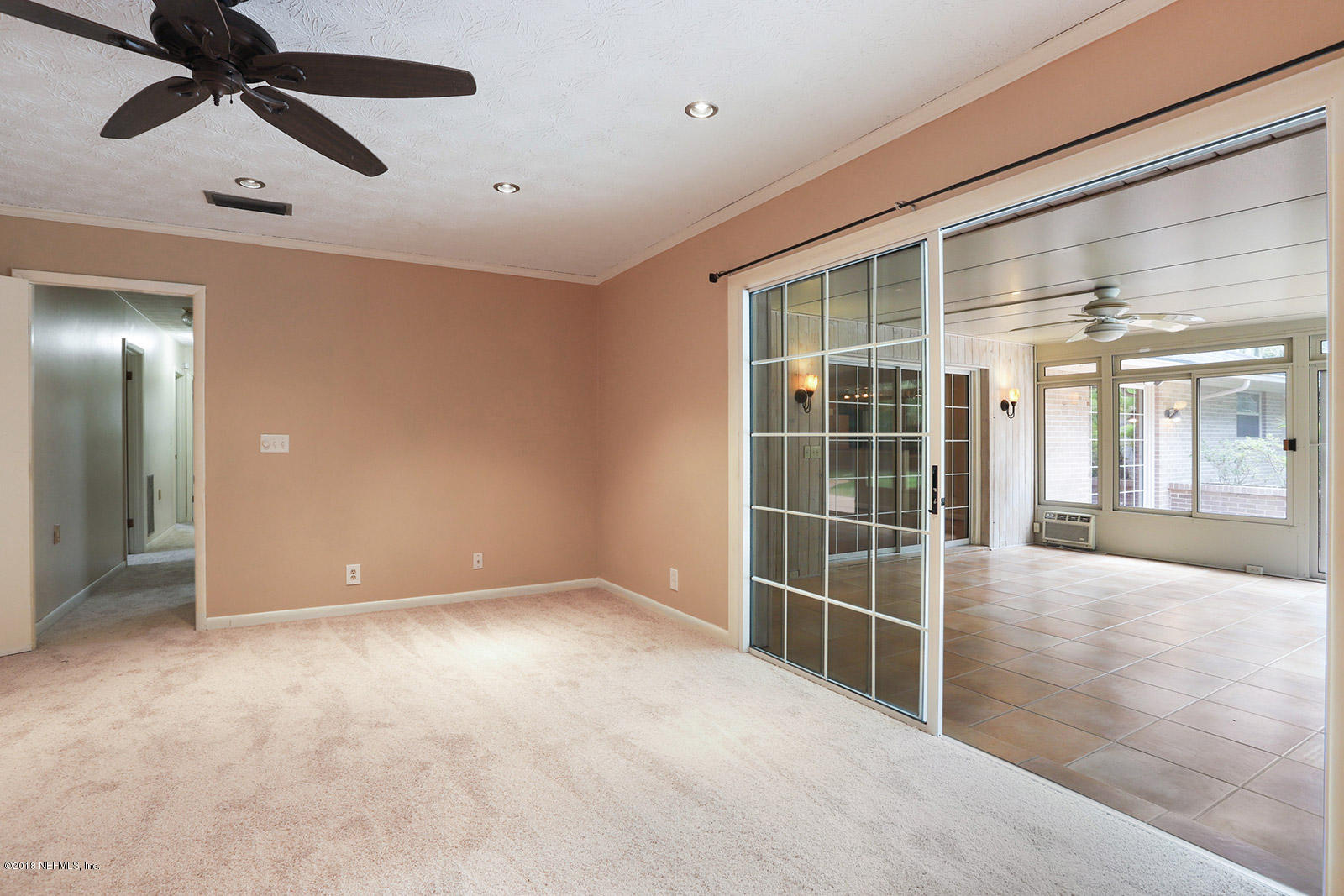 9482 Wexford Road Jacksonville, FL 32257 - Photo 12 of 25 a view of an empty room with a window