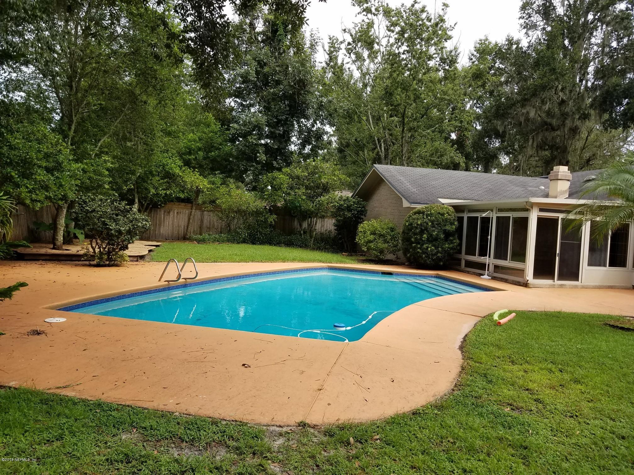9482 Wexford Road Jacksonville, FL 32257 - Photo 15 of 25 a view of a house with swimming pool and yard