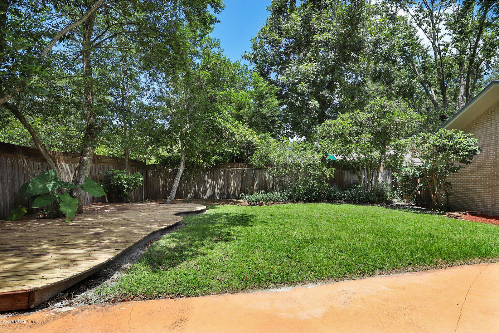 9482 Wexford Road Jacksonville, FL 32257 - Photo 17 of 25 a backyard of a house with lots of green space