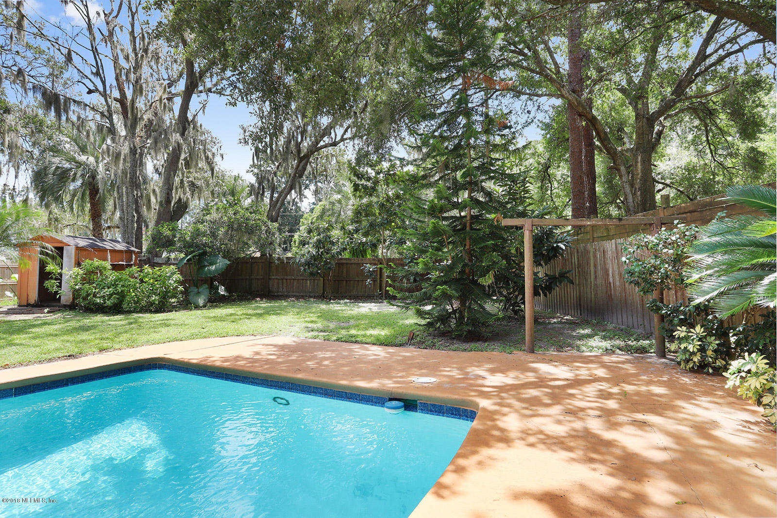 9482 Wexford Road Jacksonville, FL 32257 - Photo 18 of 25 a view of a backyard with a small cabin