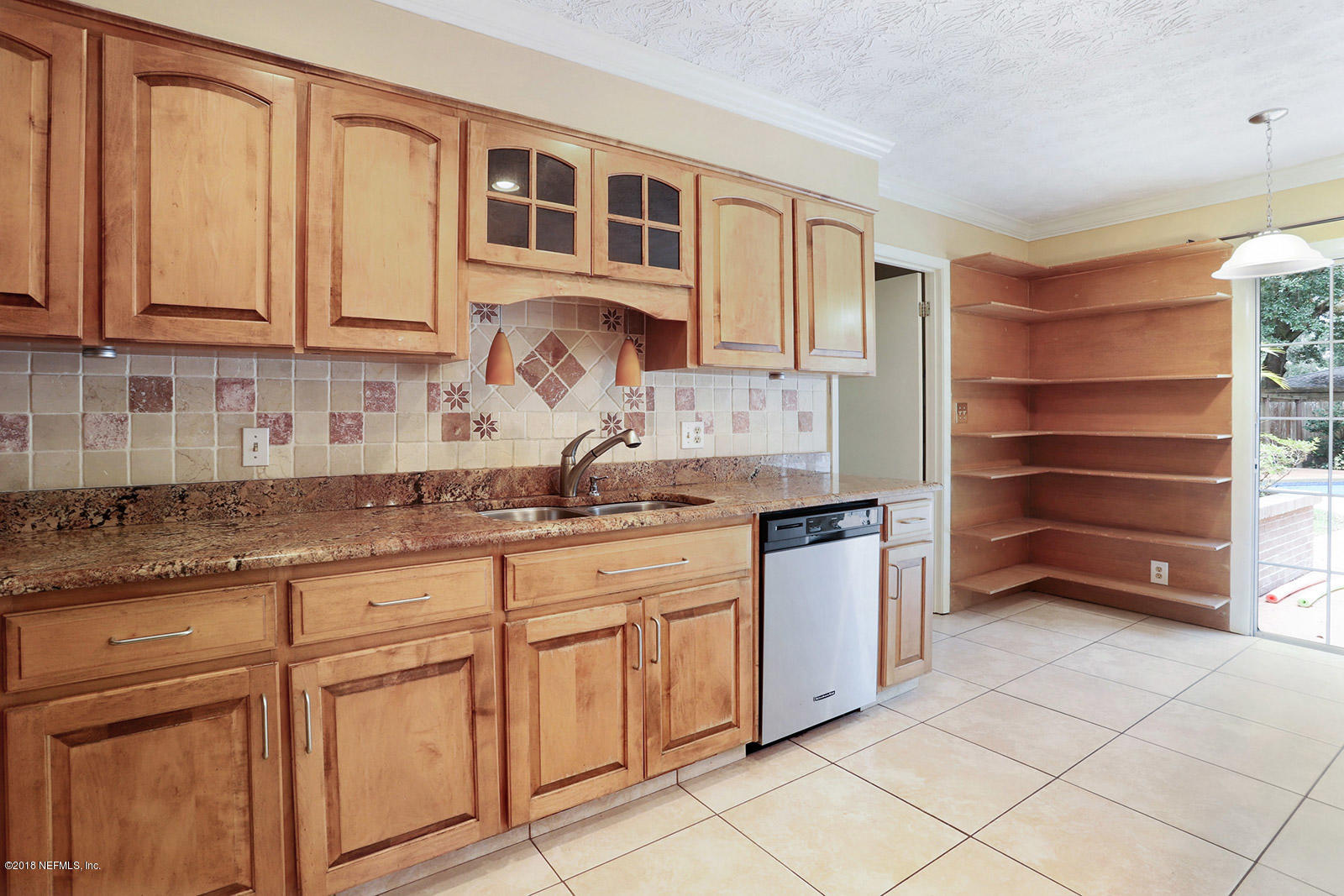 9482 Wexford Road Jacksonville, FL 32257 - Photo 8 of 25 a kitchen with granite countertop a sink and cabinets