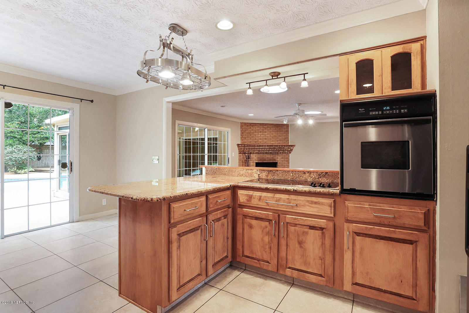 9482 Wexford Road Jacksonville, FL 32257 - Photo 9 of 25 a kitchen with cabinets a sink and appliances
