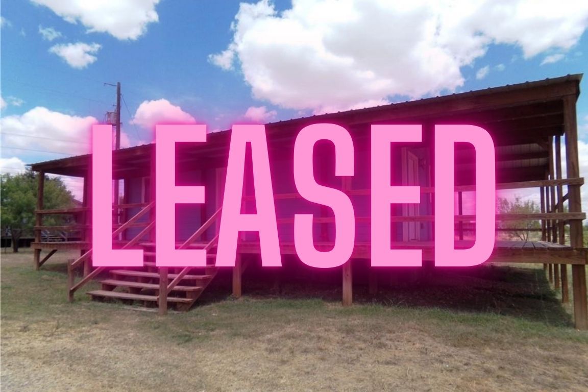 a front view of building with yard