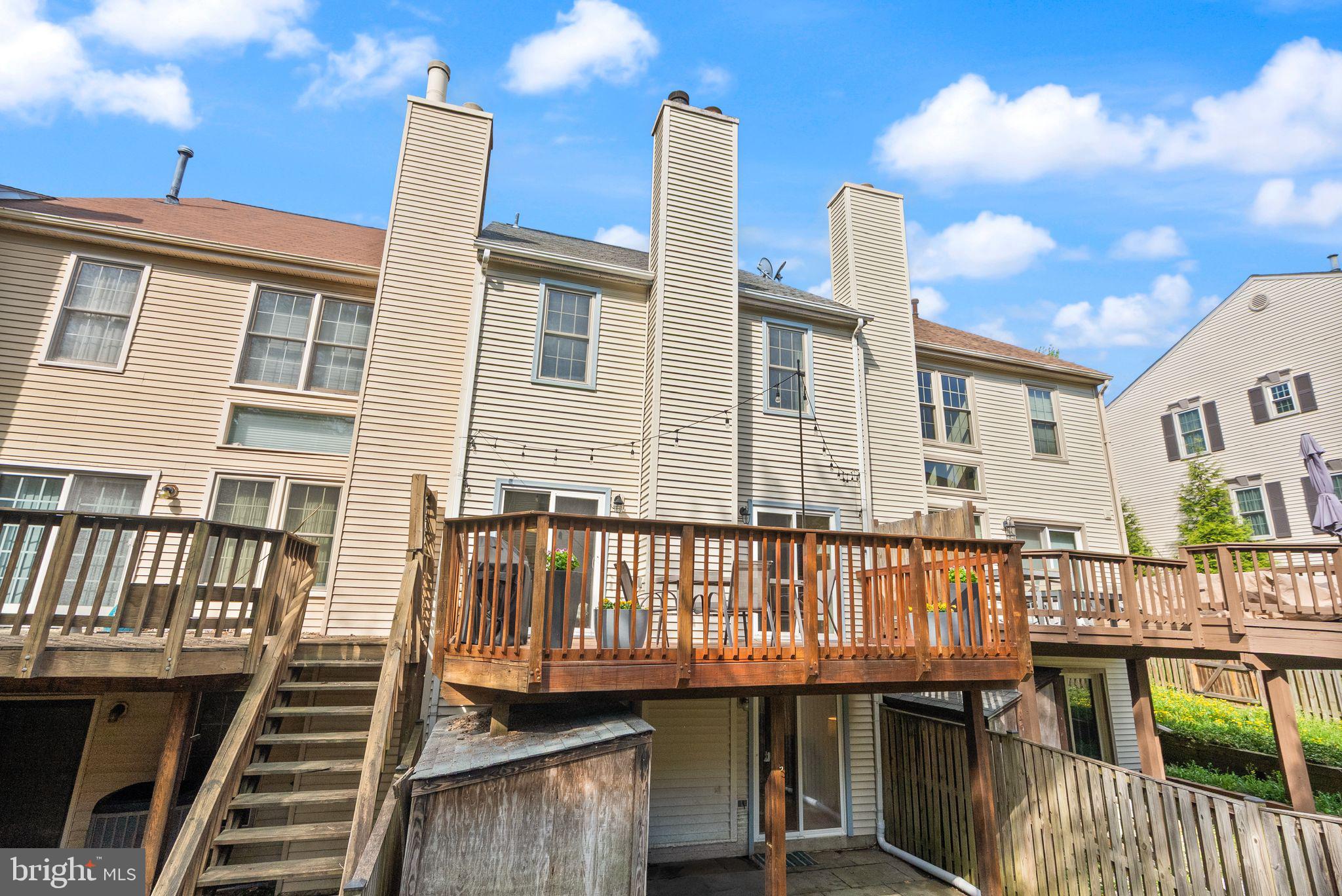 6369 English Ivy Way Springfield, VA 22152 - Photo 59 of 62 a view of a house with a wooden deck