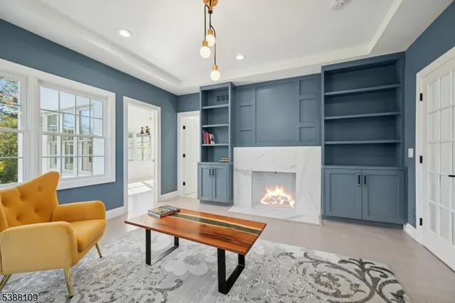 a living room with furniture a rug and a fireplace