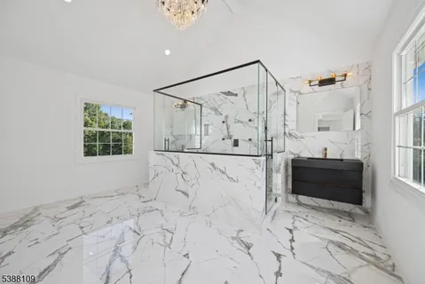 a bathroom with shower bathtub and window