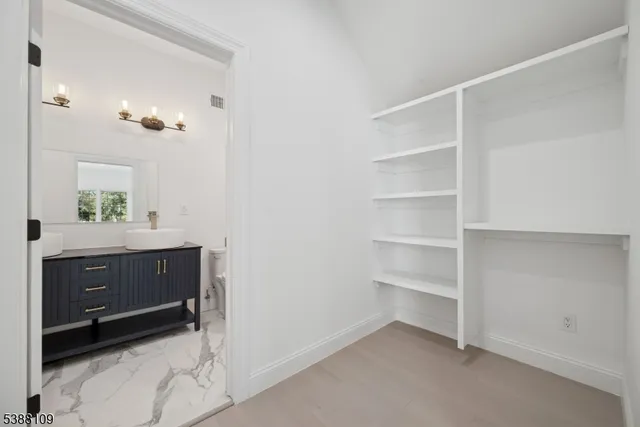 a room with a dresser and a mirror