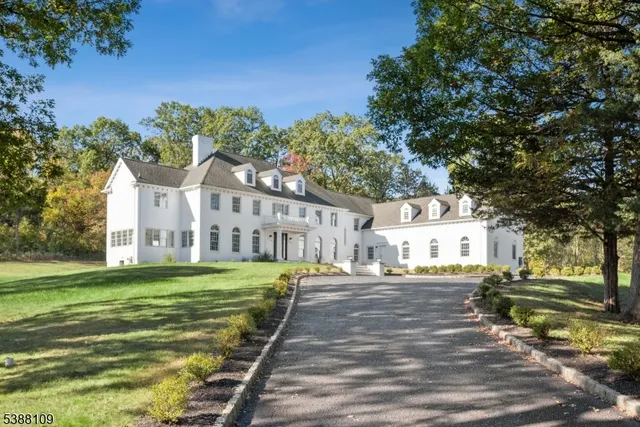 a front view of a building with a yard