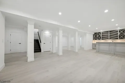 a view of an empty room with a refrigerator