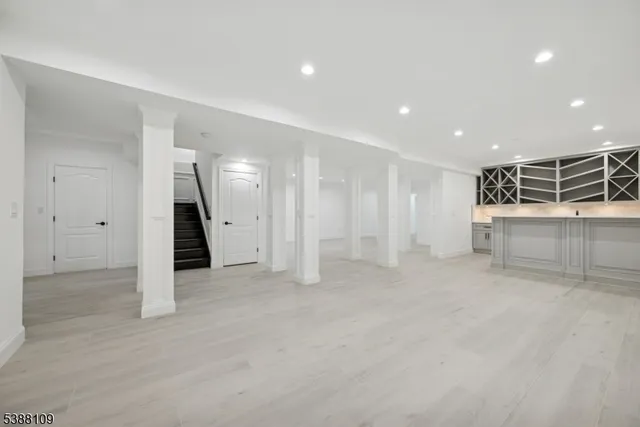 a view of an empty room with a refrigerator
