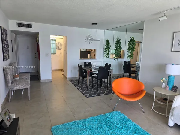 a view of a livingroom with furniture and front door