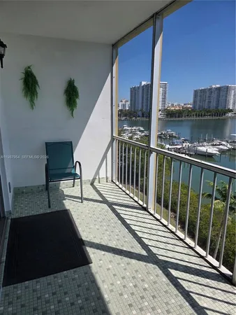 a view of a balcony with furniture