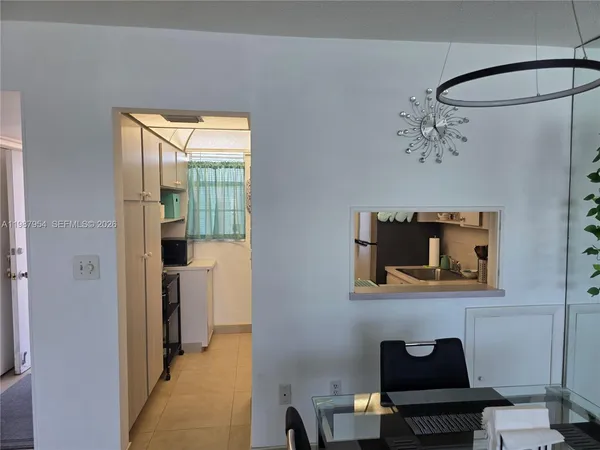 a view of a bathroom with a toilet and a shower