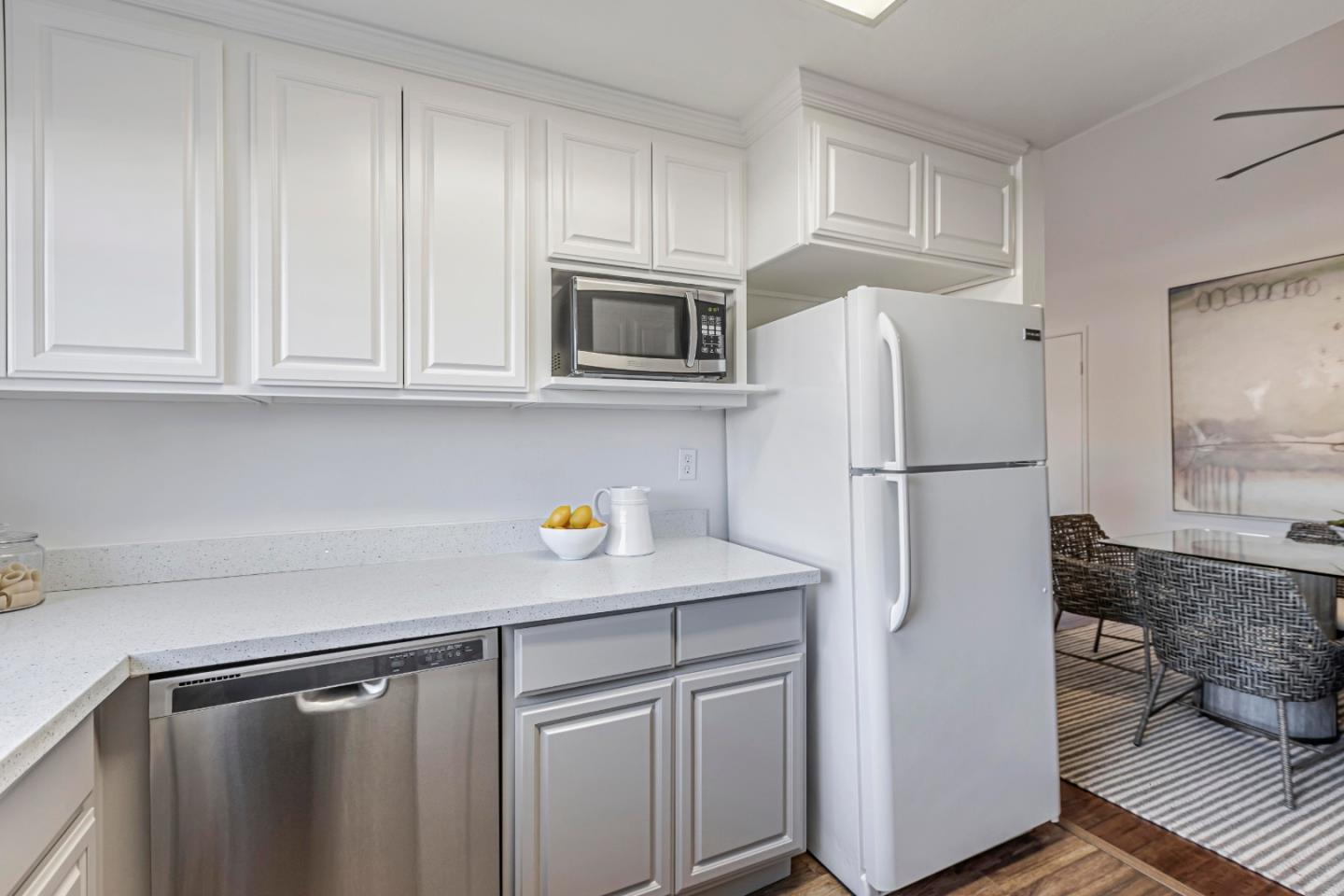 10995 Northseal Square Cupertino, CA 95014 - Photo 6 of 26 a kitchen with appliances a sink and cabinets