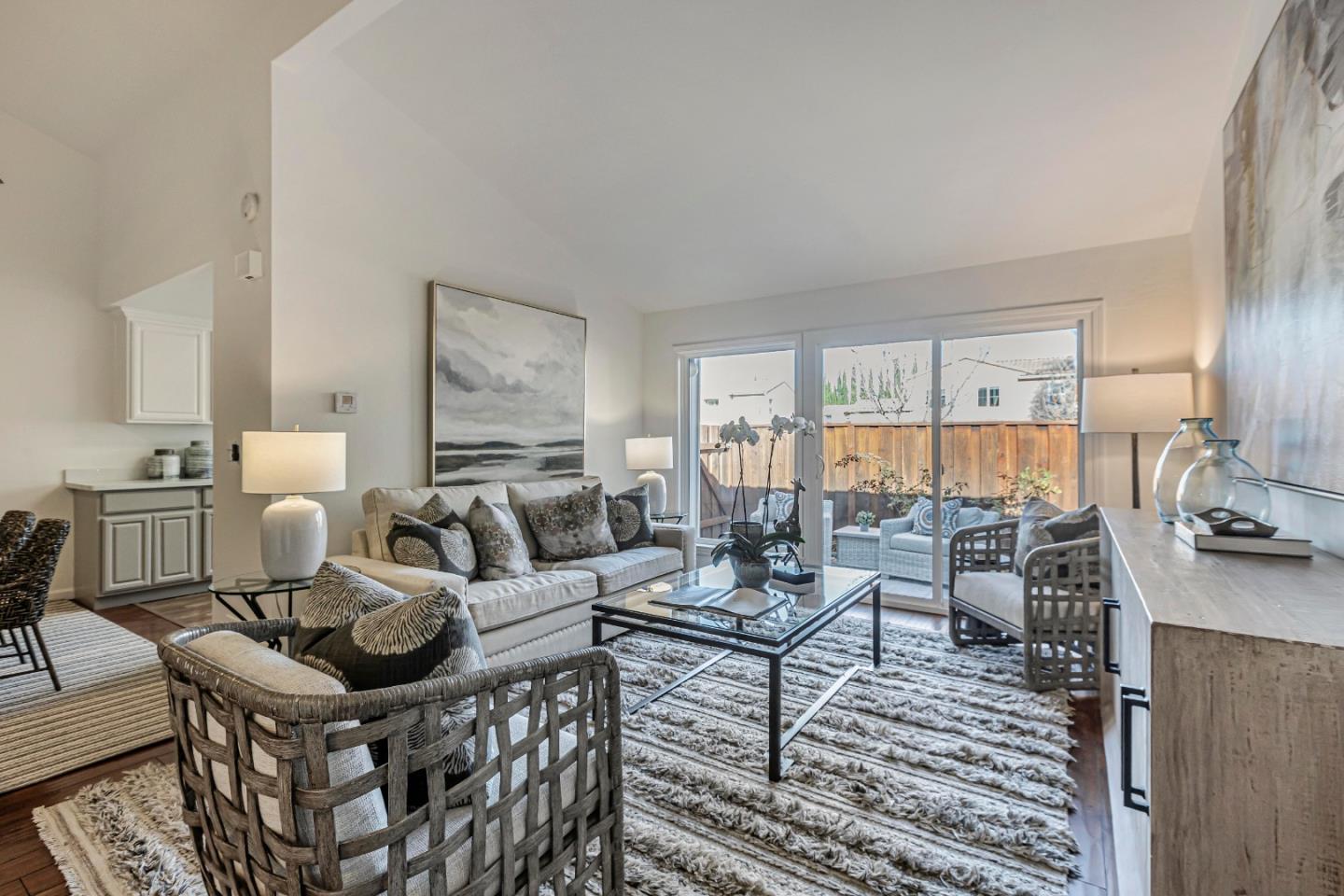 10995 Northseal Square Cupertino, CA 95014 - Photo 8 of 26 a living room with furniture and a large window