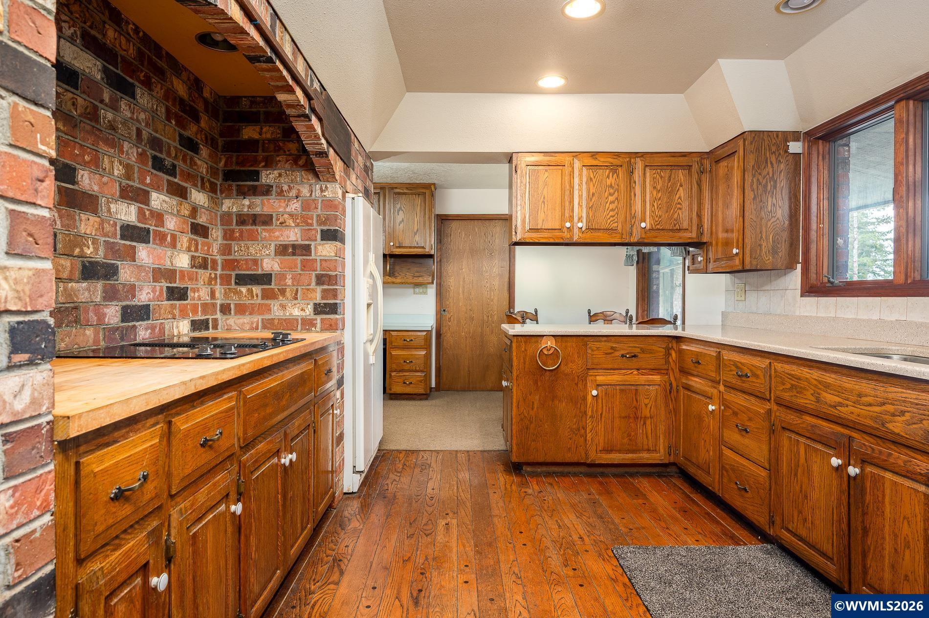 27572 South Kinzy Road Estacada, OR 97023 - Photo 12 of 50 a large kitchen with stainless steel appliances granite countertop a sink and cabinets
