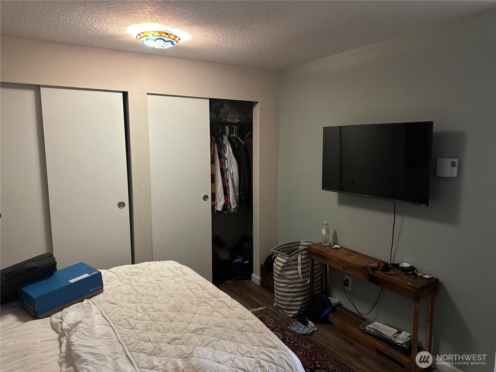 2232 Northwest 58th Street Seattle, WA 98107 - Photo 13 of 21 a bedroom with a bed and a flat screen tv