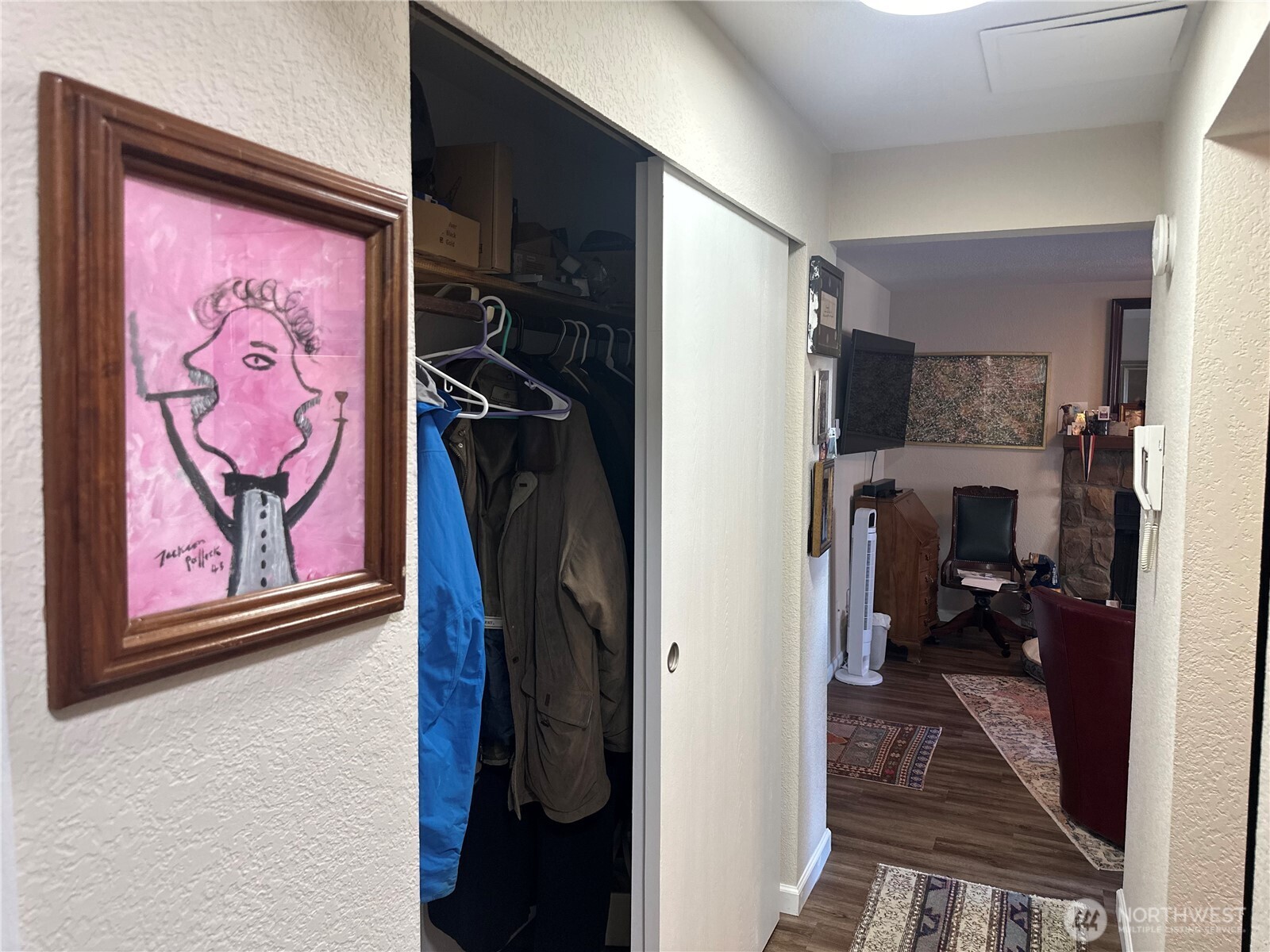 2232 Northwest 58th Street Seattle, WA 98107 - Photo 16 of 21 a view of a hallway with paintings on the wall