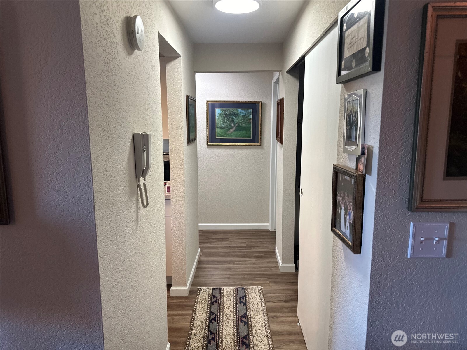 2232 Northwest 58th Street Seattle, WA 98107 - Photo 17 of 21 a view of a hallway with wooden floor and staircase