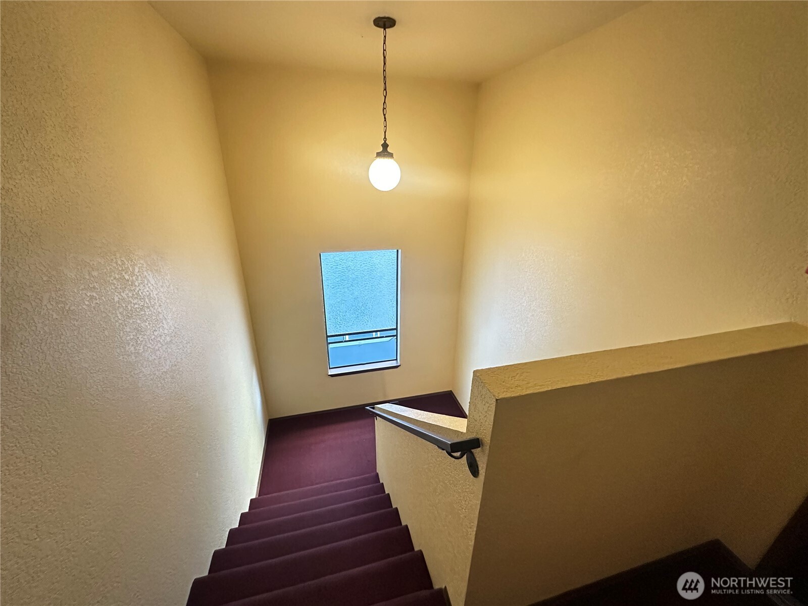 2232 Northwest 58th Street Seattle, WA 98107 - Photo 19 of 21 a view of a livingroom with wooden floor and a ceiling fan