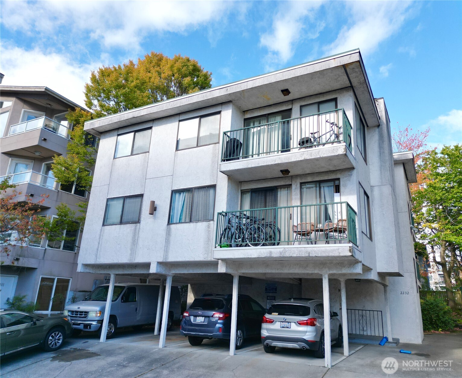 2232 Northwest 58th Street Seattle, WA 98107 - Photo 5 of 21 a car parked in front of a house