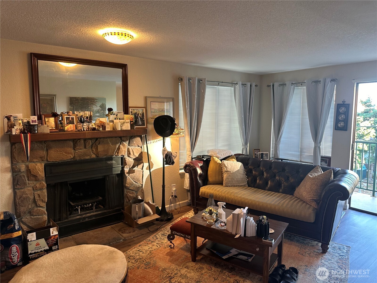 2232 Northwest 58th Street Seattle, WA 98107 - Photo 7 of 21 a living room with furniture and a fireplace
