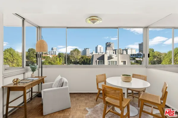 a outdoor living space with furniture and a floor to ceiling window