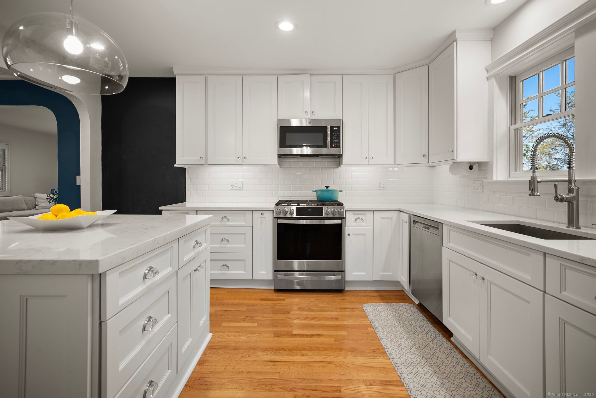 88 Overhill Road Fairfield, CT 06824 - Photo 11 of 37 a kitchen with stainless steel appliances granite countertop a sink and cabinets