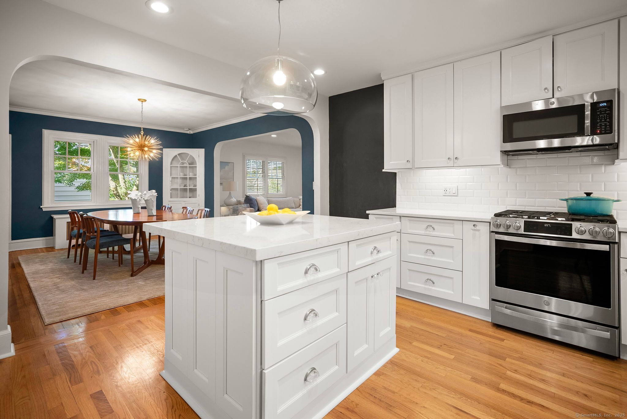 88 Overhill Road Fairfield, CT 06824 - Photo 12 of 37 a kitchen with stainless steel appliances kitchen island granite countertop a stove and a wooden floors