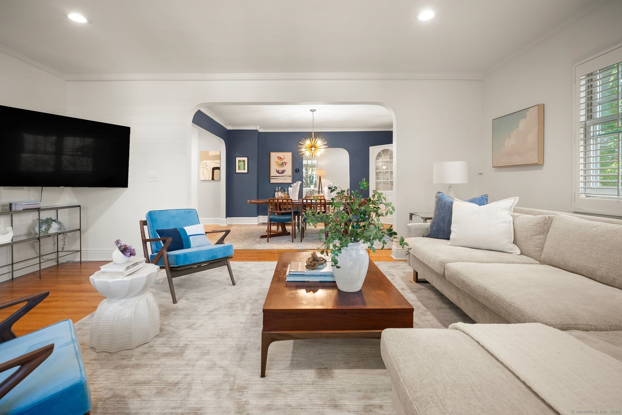 88 Overhill Road Fairfield, CT 06824 - Photo 15 of 37 a living room with furniture and a flat screen tv