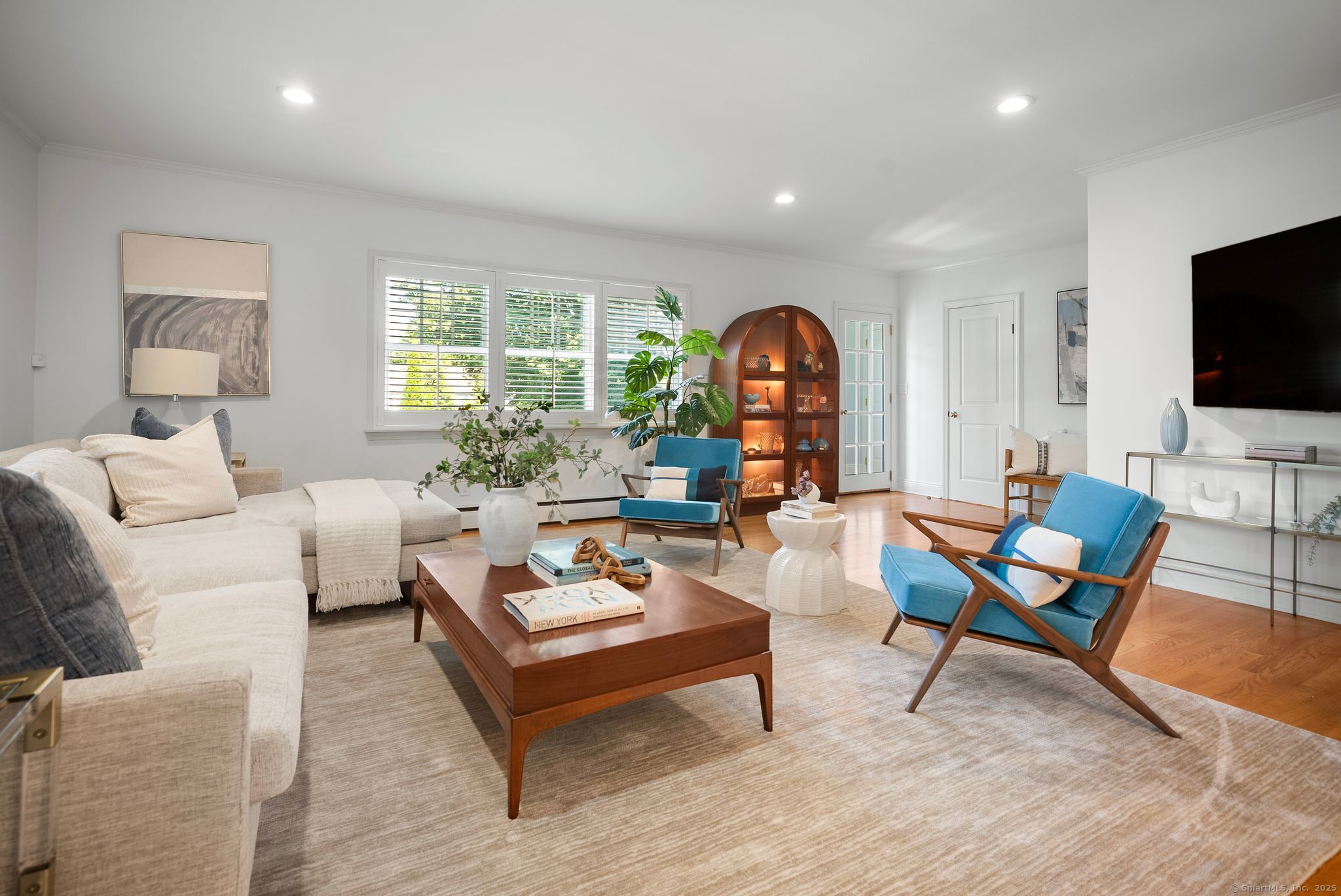 88 Overhill Road Fairfield, CT 06824 - Photo 16 of 37 a living room with furniture and a flat screen tv
