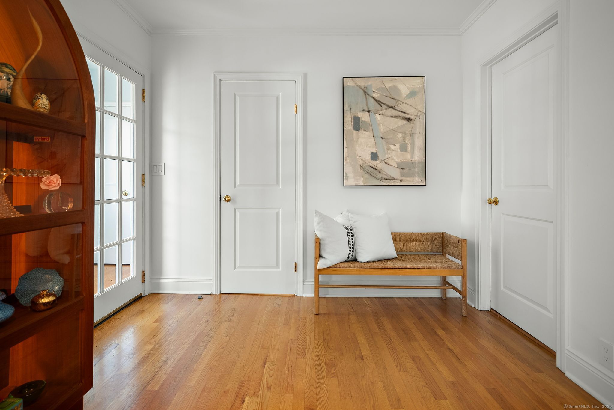 88 Overhill Road Fairfield, CT 06824 - Photo 17 of 37 a view of an empty room with a window and wooden floor