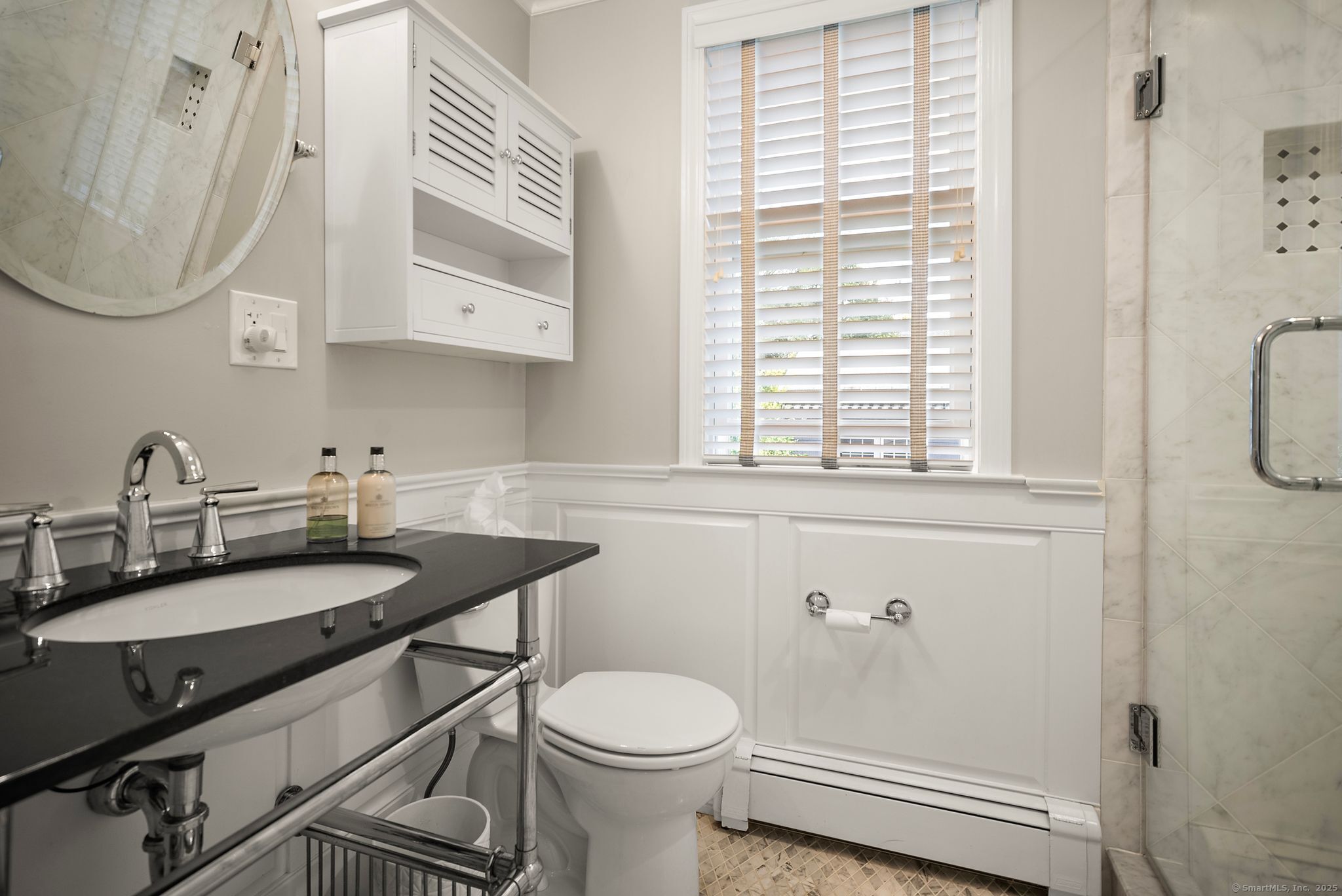 88 Overhill Road Fairfield, CT 06824 - Photo 18 of 37 a bathroom with a sink a toilet and a mirror