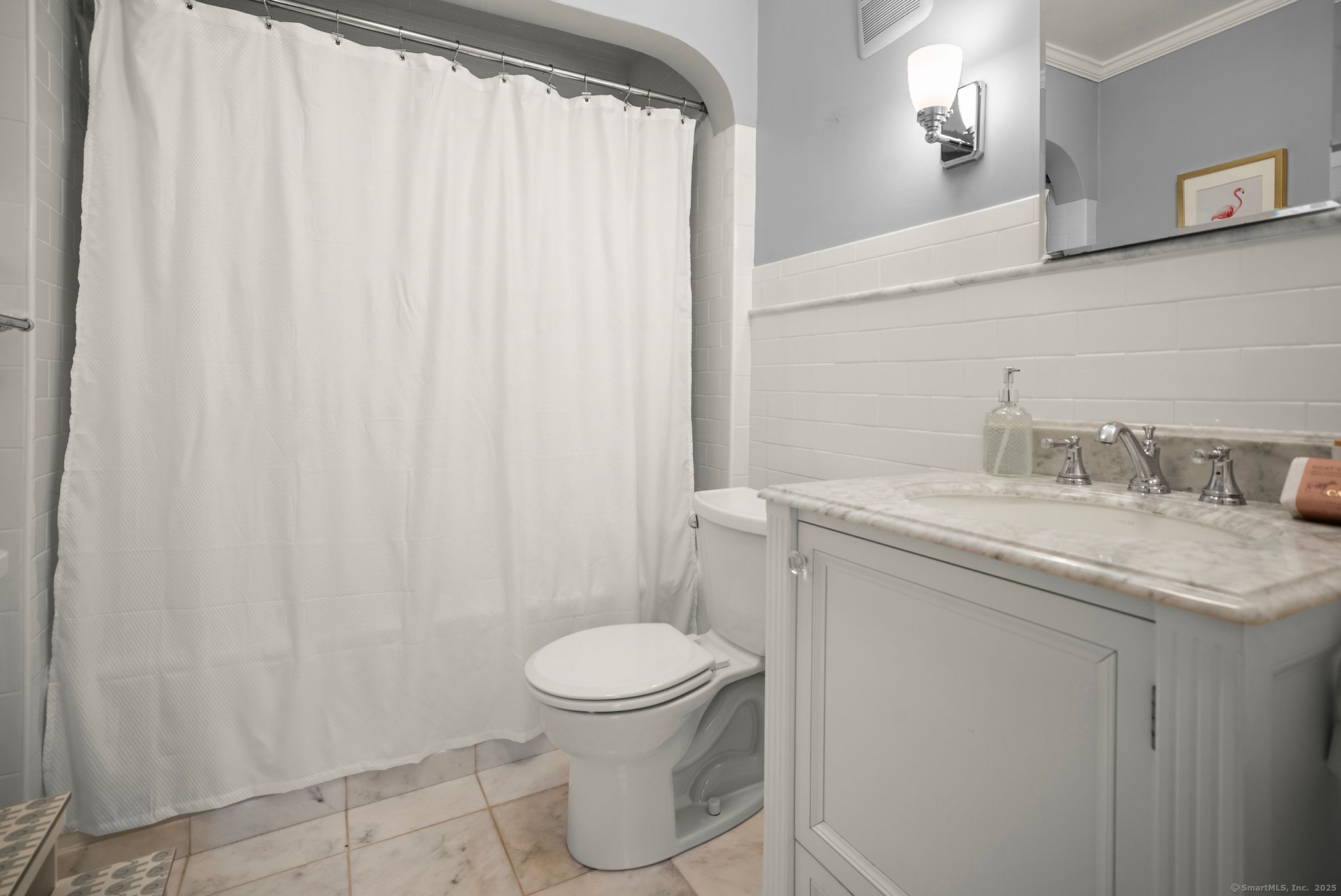 88 Overhill Road Fairfield, CT 06824 - Photo 27 of 37 a bathroom with a granite countertop sink toilet and a mirror