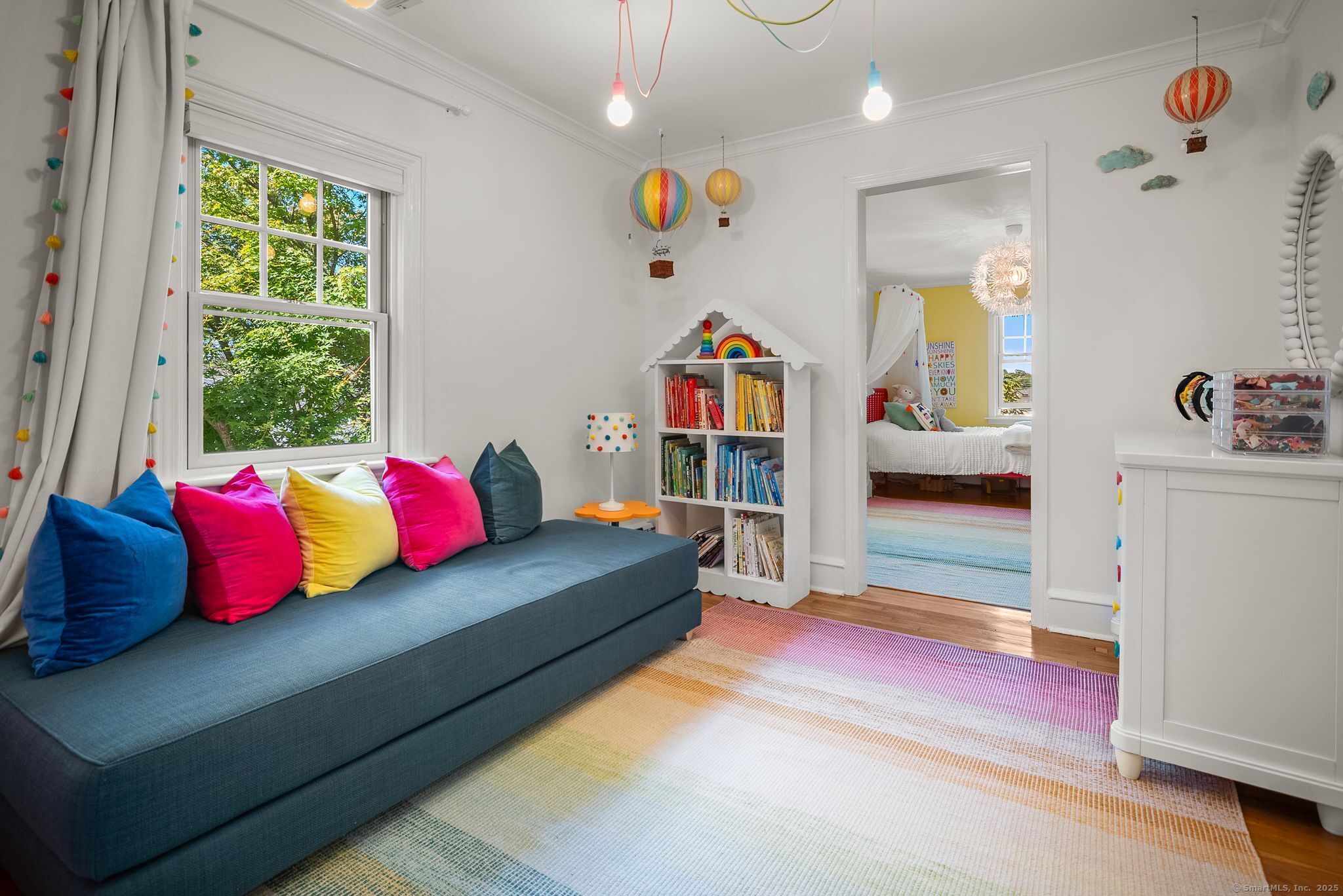 88 Overhill Road Fairfield, CT 06824 - Photo 28 of 37 a living room with furniture and a book shelf