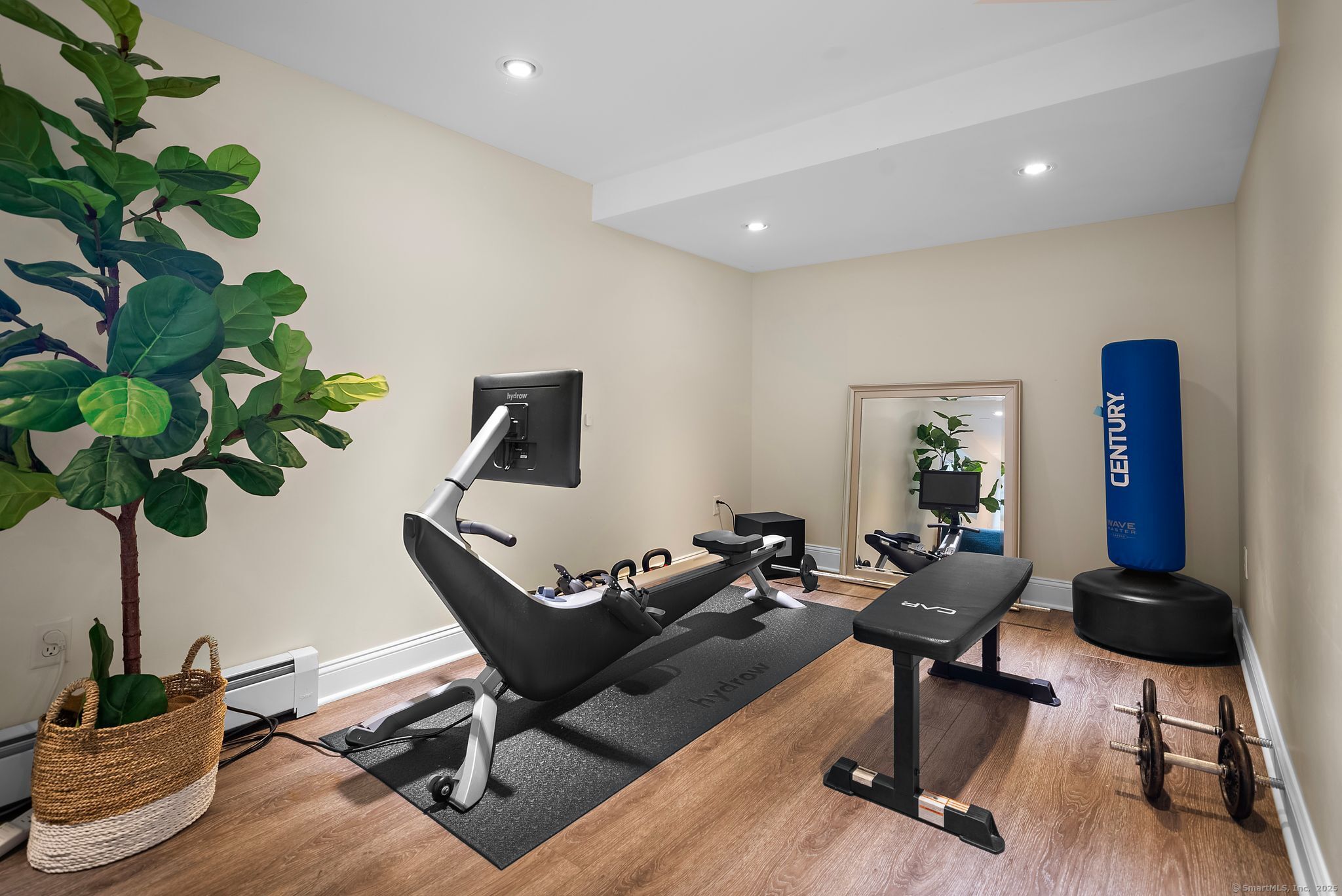 88 Overhill Road Fairfield, CT 06824 - Photo 32 of 37 a living room with furniture hard wood floor and potted plant