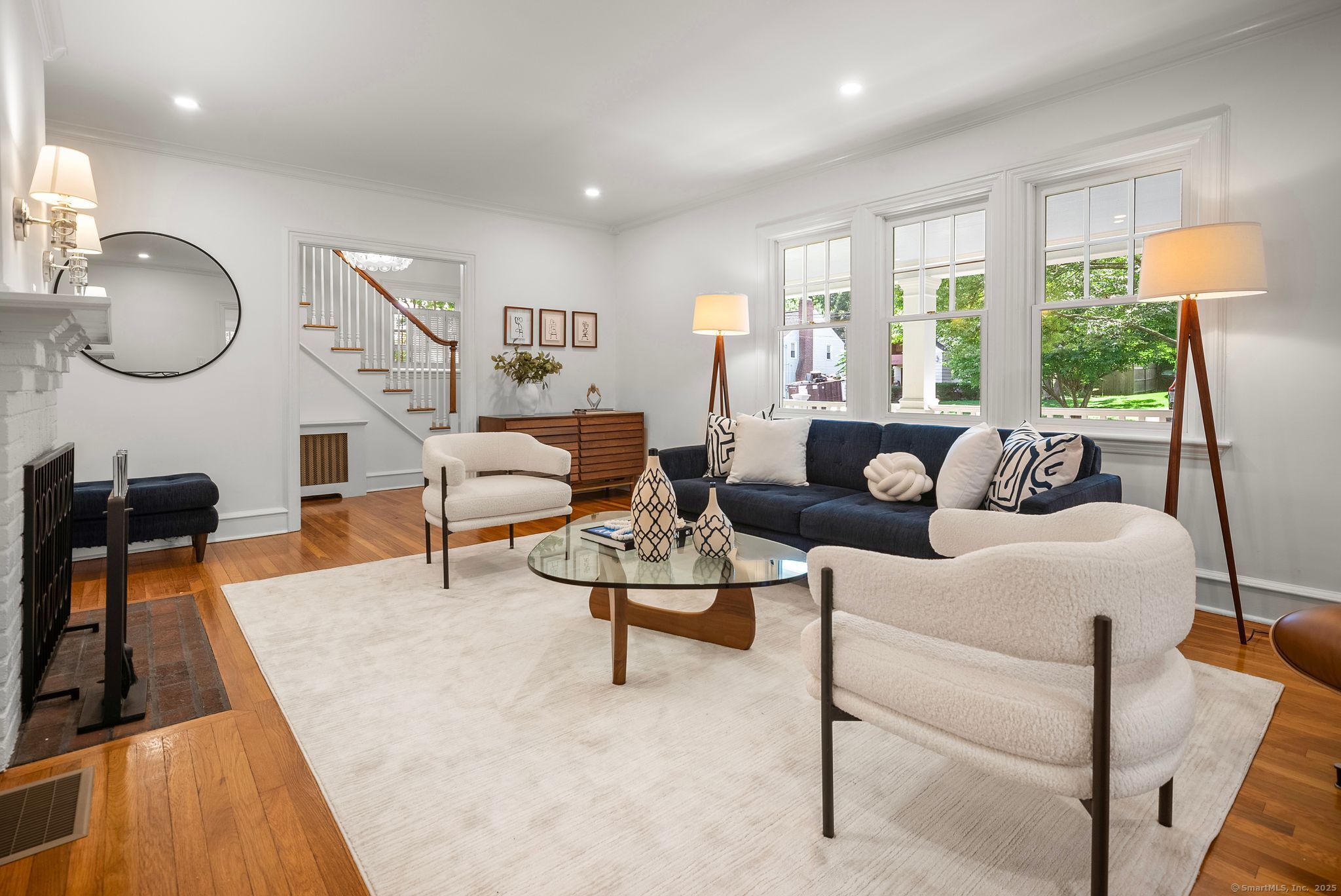 88 Overhill Road Fairfield, CT 06824 - Photo 5 of 37 a living room with furniture fireplace and a large window
