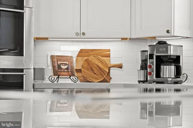 a bathroom with a sink vanity and a mirror
