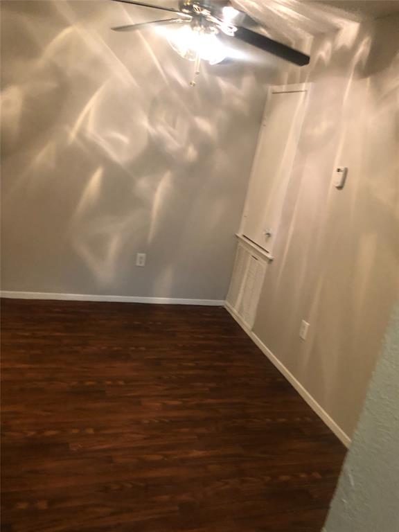 9696 Walnut Street, Unit 2103 Dallas, TX 75243 - Photo 5 of 7 Rich wood-finish flooring complements light-toned walls