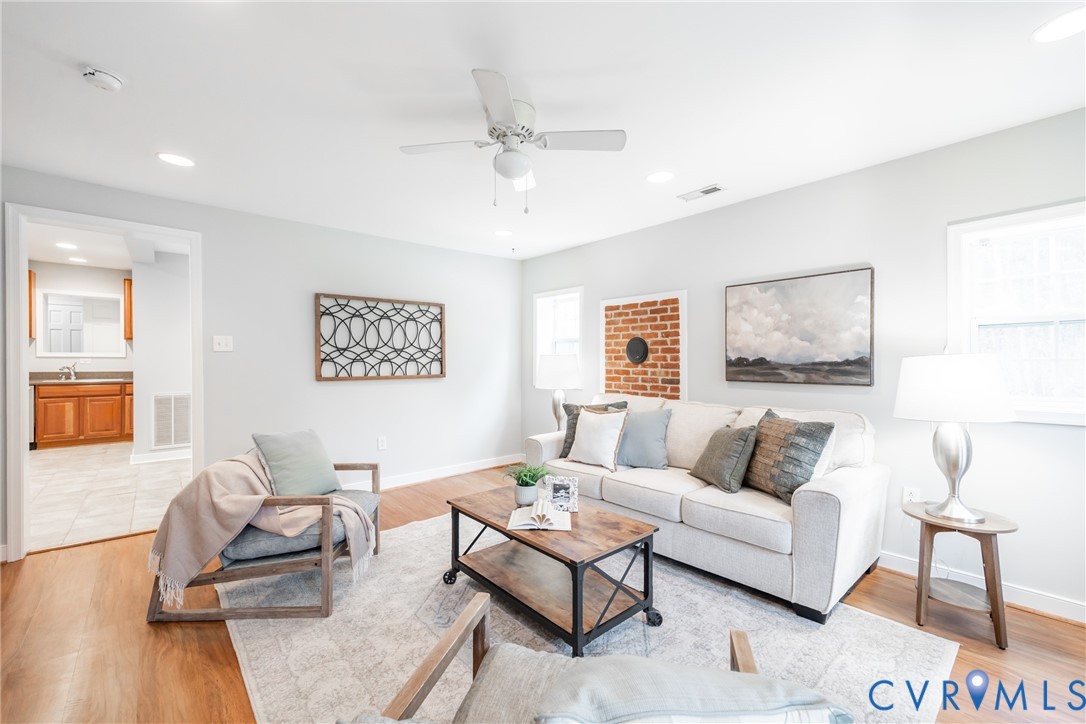 795 Snead Road Manakin-Sabot, VA 23103 - Photo 14 of 31 a living room with furniture and a wooden floor