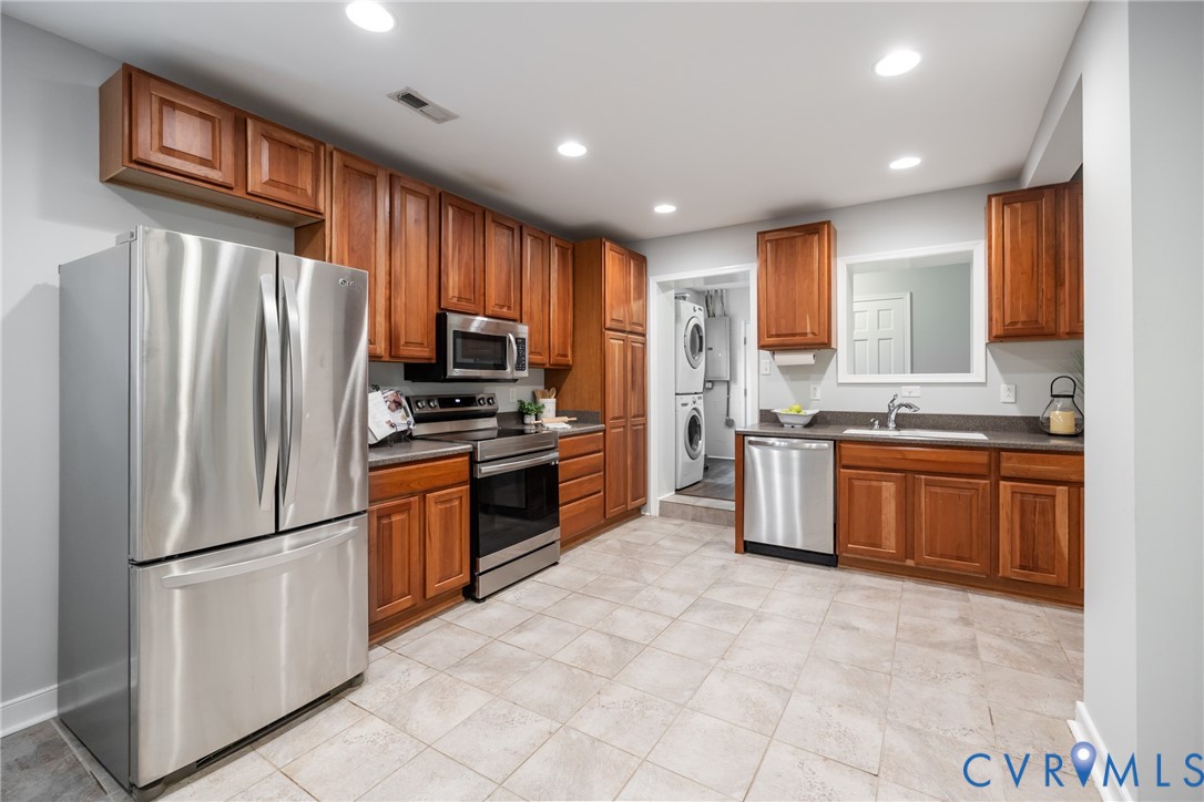 795 Snead Road Manakin-Sabot, VA 23103 - Photo 16 of 31 a kitchen with stainless steel appliances granite countertop a refrigerator sink and stove