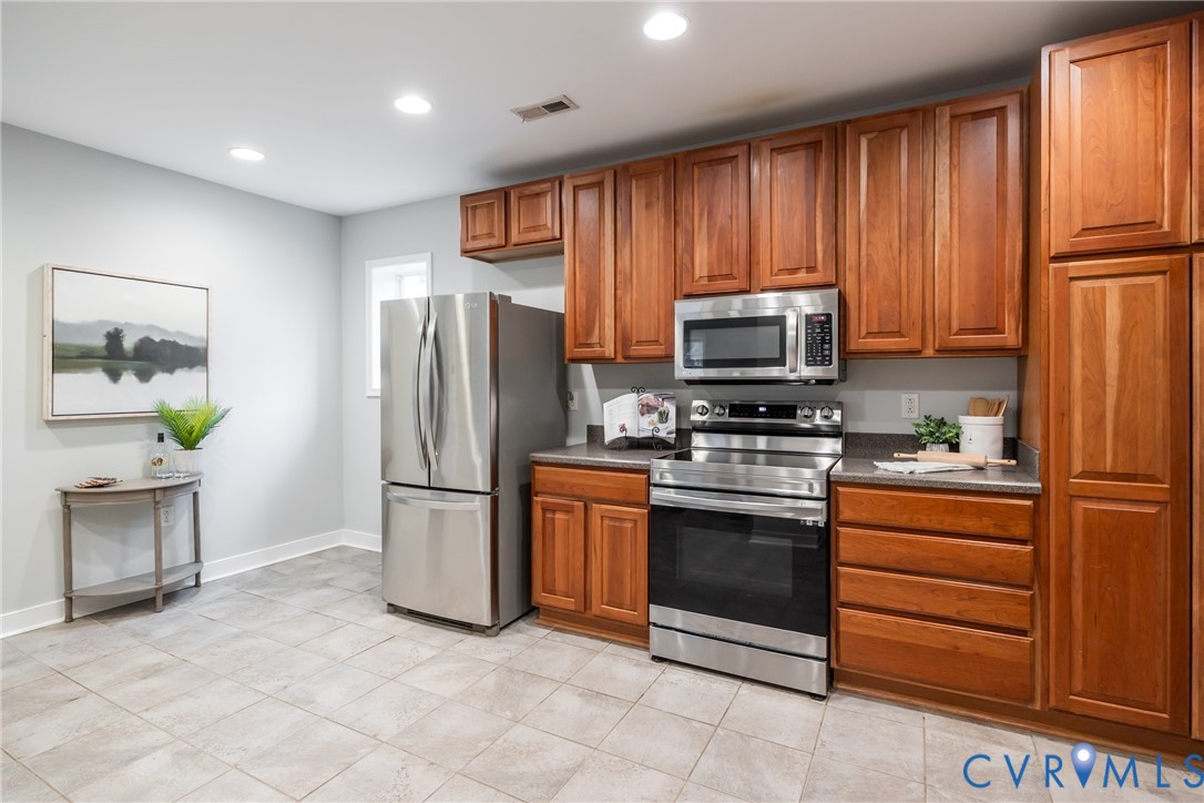 795 Snead Road Manakin-Sabot, VA 23103 - Photo 18 of 31 a kitchen with stainless steel appliances granite countertop a refrigerator and a stove top oven