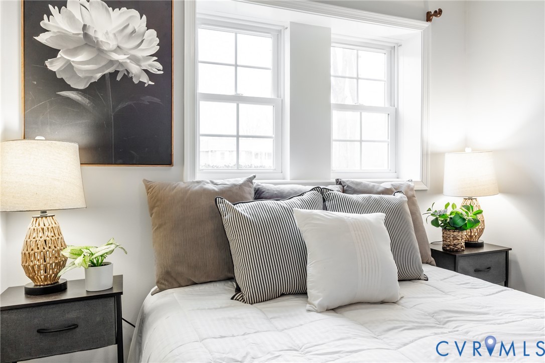 795 Snead Road Manakin-Sabot, VA 23103 - Photo 25 of 31 a bed sitting in a bedroom next to a window with potted plant