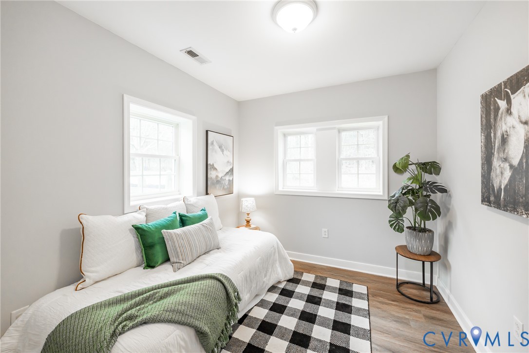795 Snead Road Manakin-Sabot, VA 23103 - Photo 28 of 31 a bedroom with a bed and a potted plant