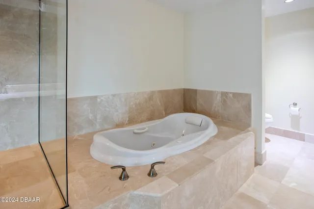 a bathroom with a tub and sink