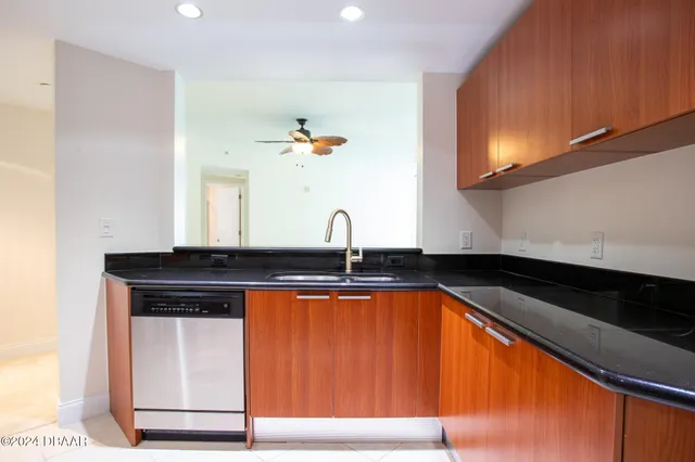 a sink with a close view of a sink and dishwasher